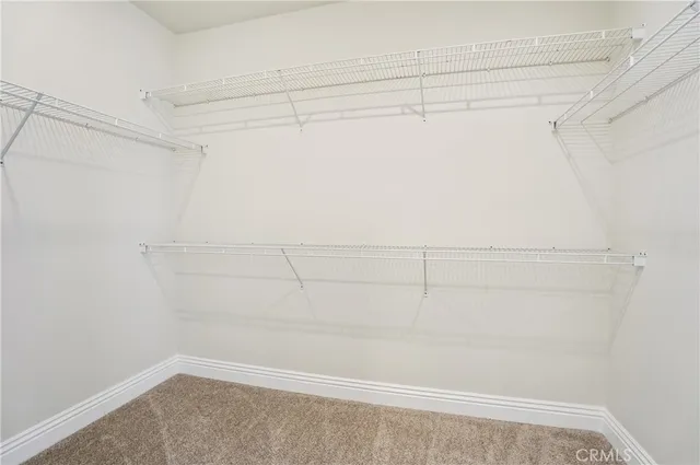 a large bathroom with a granite countertop double vanity sink a mirror and a shower