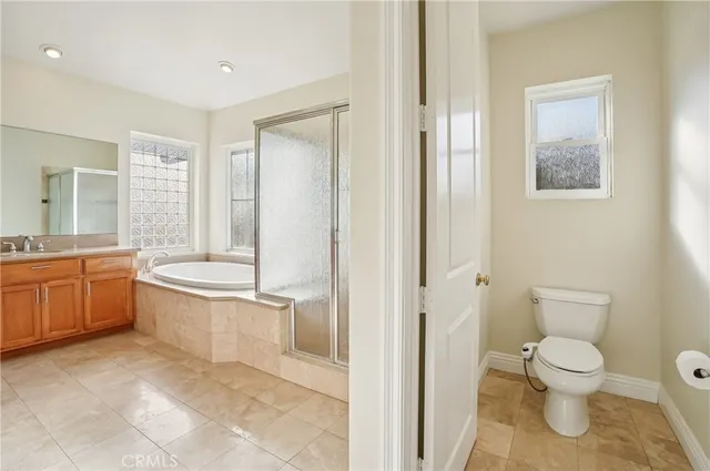 a bathroom with a glass shower door and a bathtub