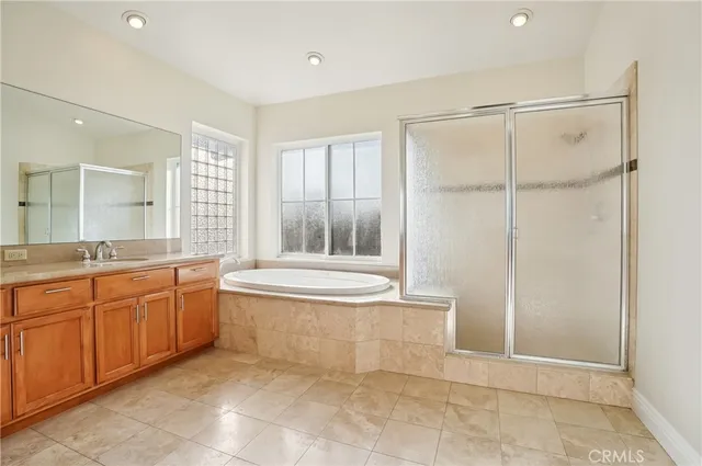 a bedroom with a bed and glass window