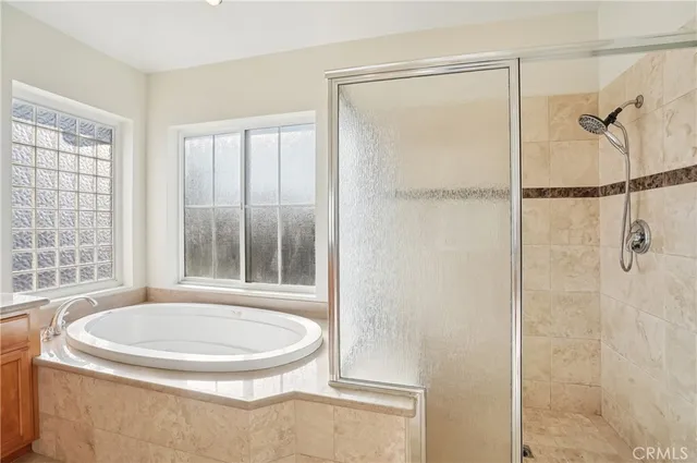 a bedroom with a bed and a walk in closet