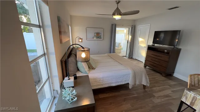 a bedroom with furniture and a mirror