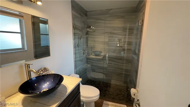 a bathroom with a toilet and a sink