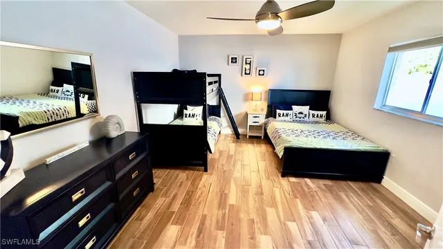 a living room with a bed furniture and a table