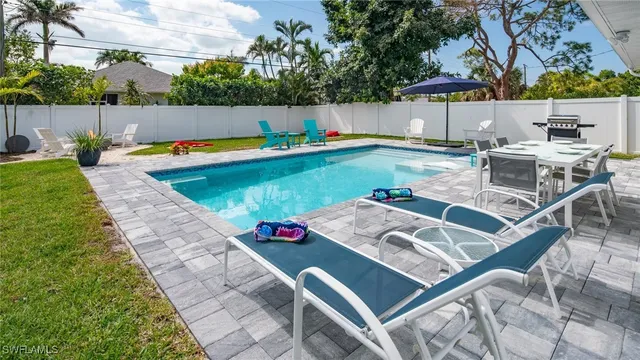 a view of swimming pool with a patio