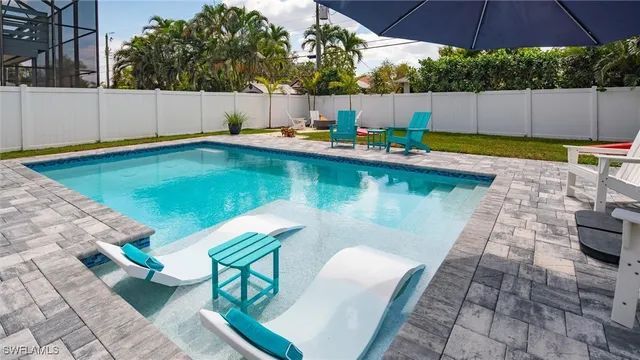 a view of a swimming pool with a patio