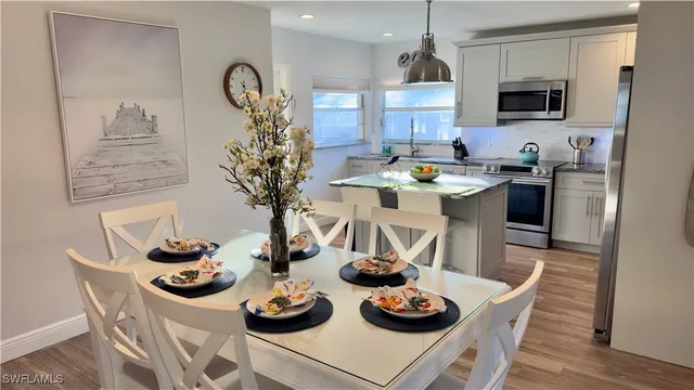 a kitchen with a table and chairs in it
