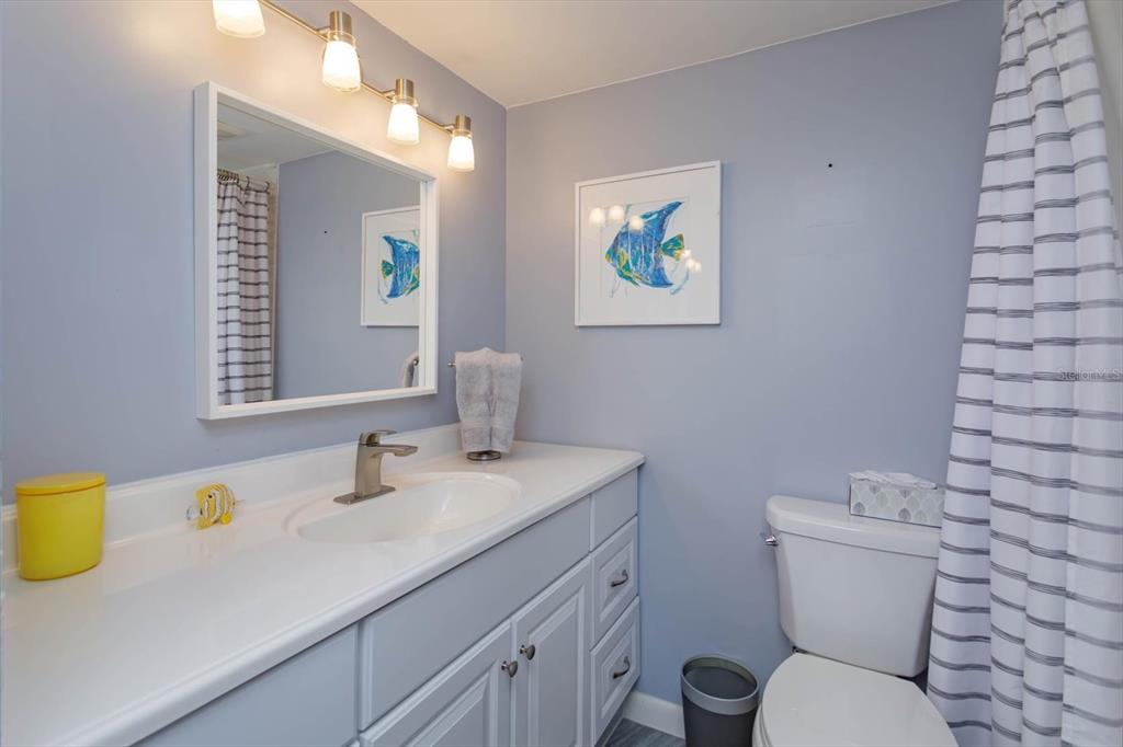 240 Orienta Point Street, Unit 240 Altamonte Springs, FL 32701 - Photo 10 of 20 a bathroom with a granite countertop toilet sink and mirror