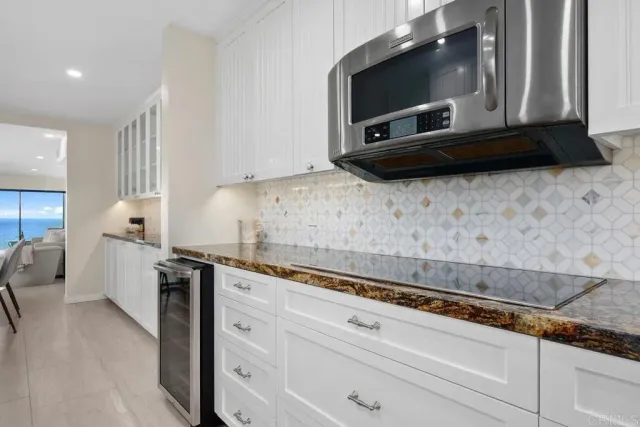 a spacious bedroom with a bed and a lamp