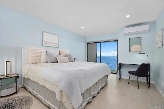 a bedroom with a bed and a chair