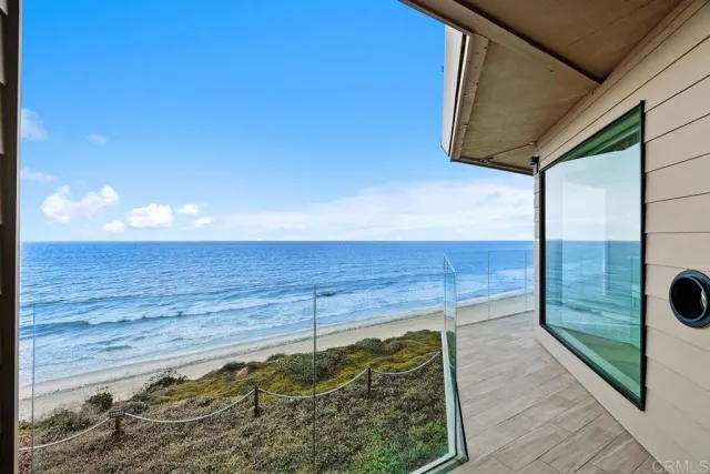 a bathroom with a granite countertop sink a large mirror and shower