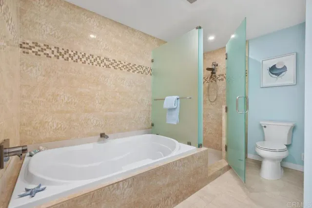 a bedroom with a bed and a chair