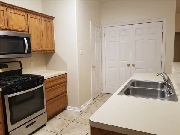 a kitchen with a stove and a microwave