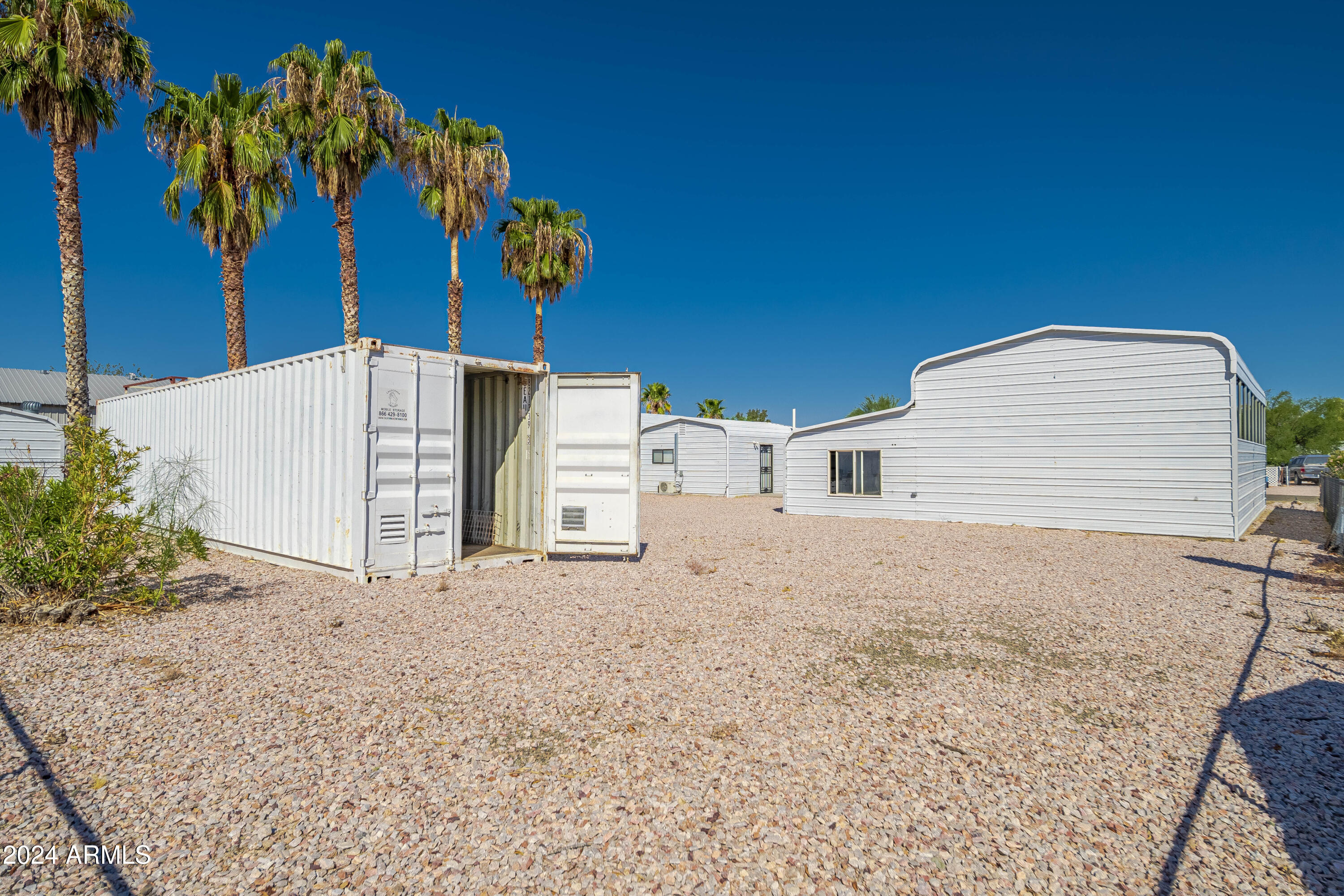 66934 Prose Lane Salome, AZ 85348 - Photo 12 of 30 a view of a house with a yard and potted plants