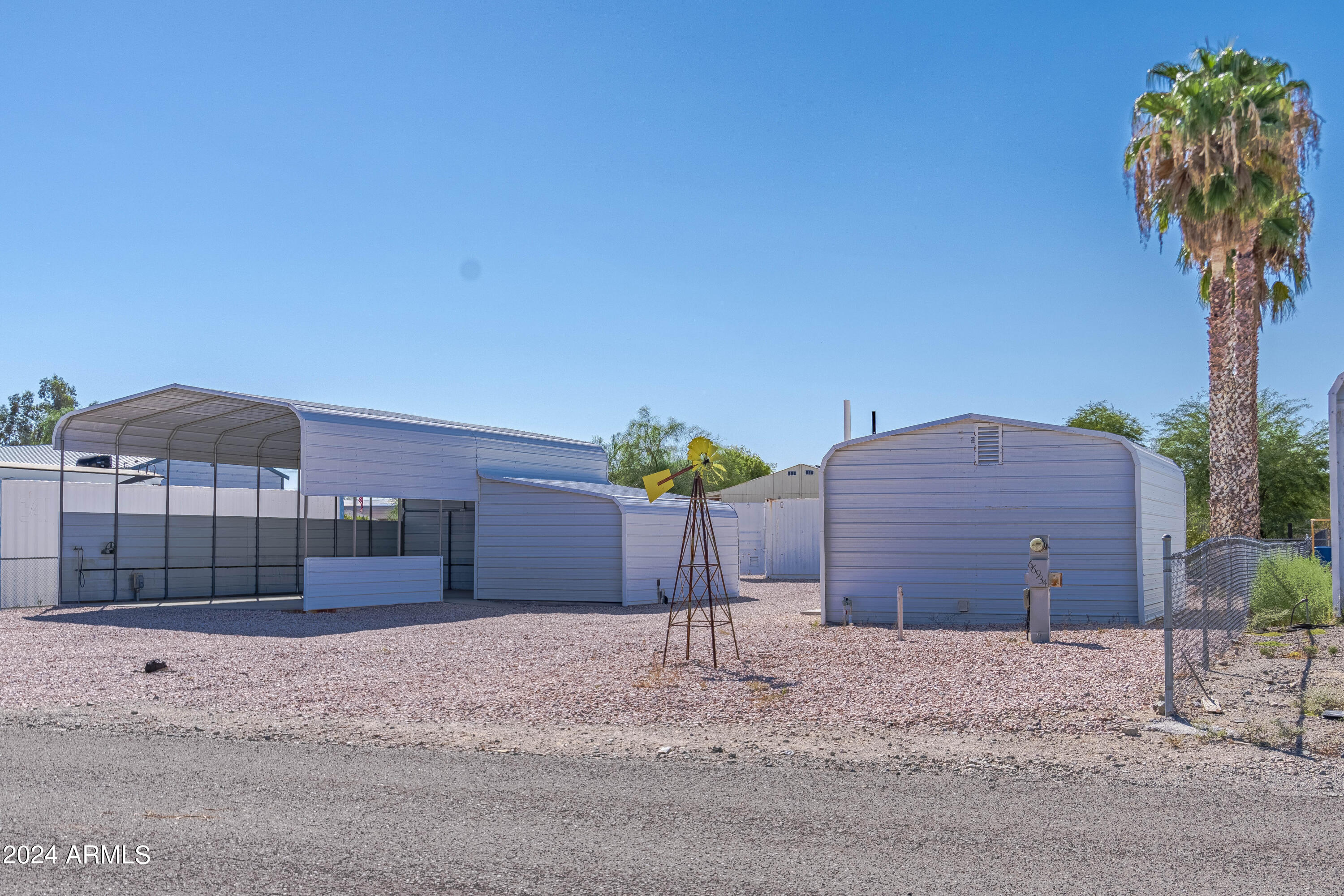 66934 Prose Lane Salome, AZ 85348 - Photo 21 of 30 a view of a house with a yard and garage