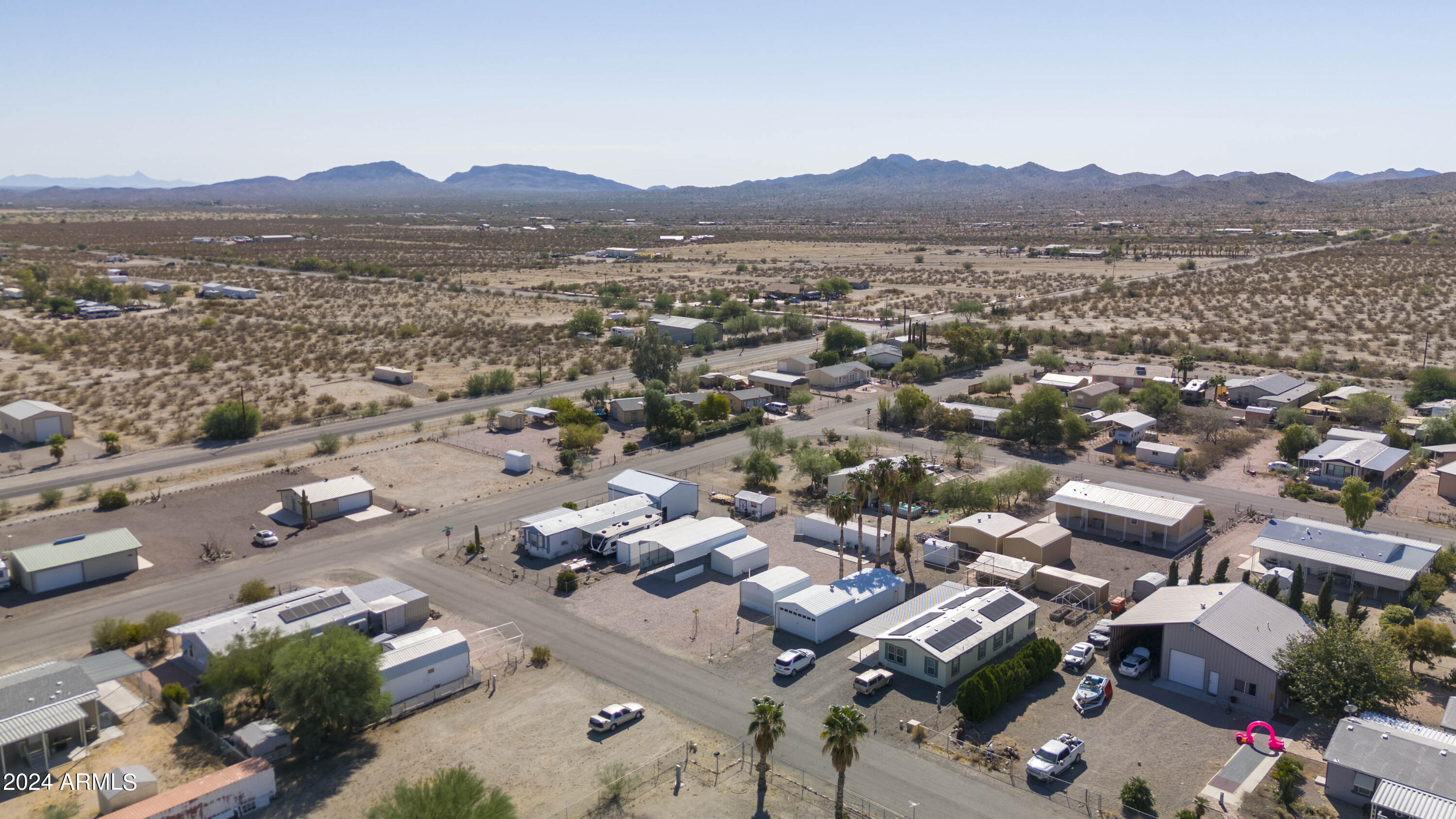 66934 Prose Lane Salome, AZ 85348 - Photo 27 of 30 an aerial view of a city with lots of residential buildings and mountain view in back