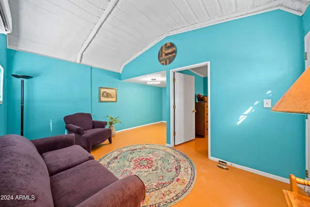 a bed room with furniture and a window