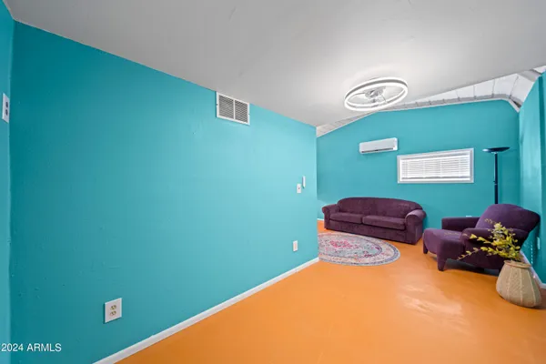 a room with furniture and a window