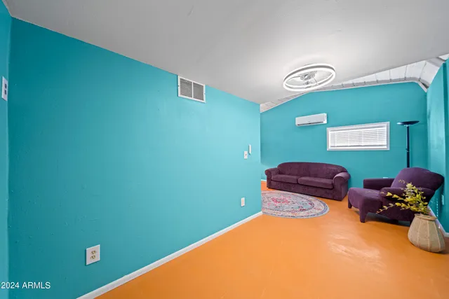 a room with furniture and a window