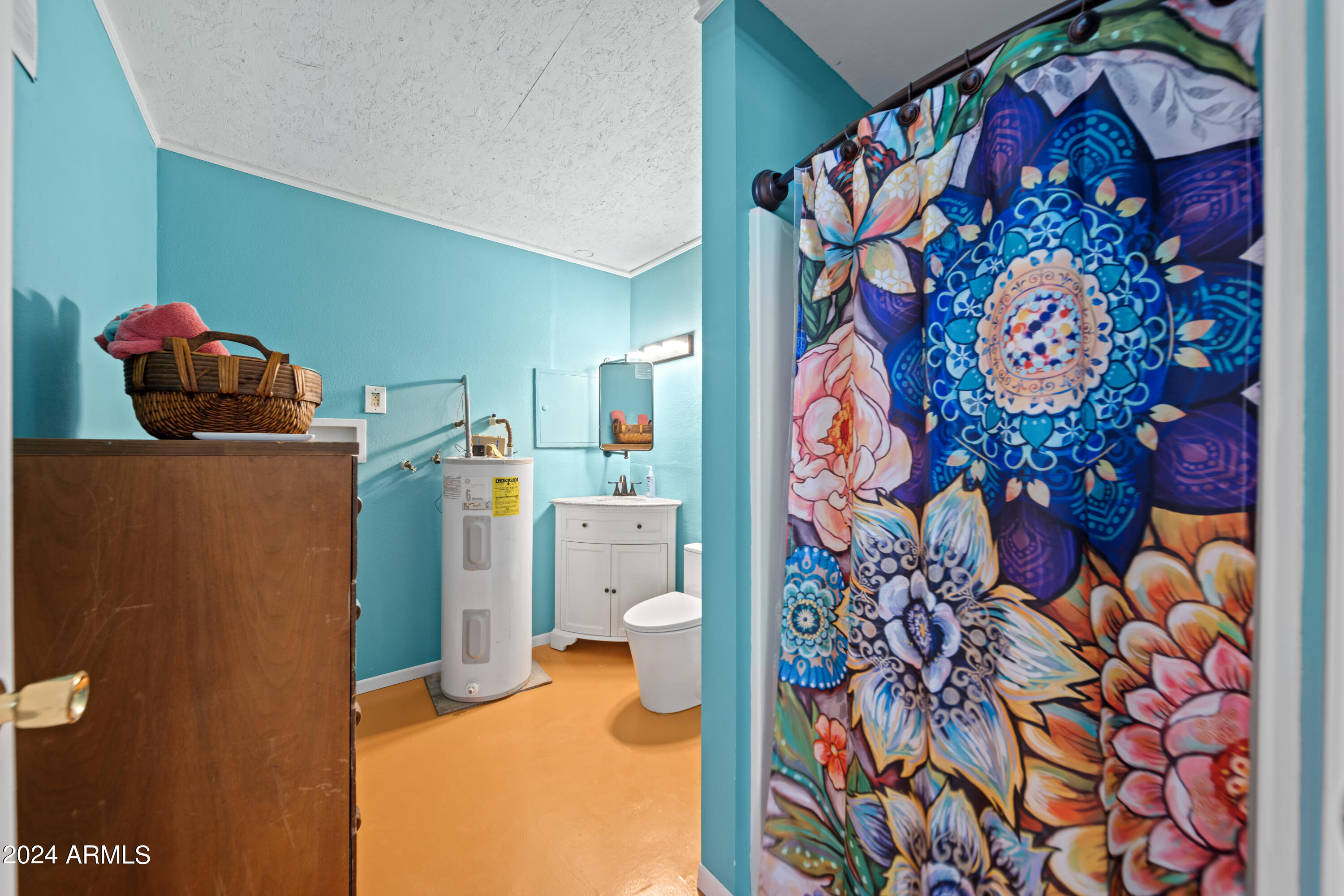 66934 Prose Lane Salome, AZ 85348 - Photo 8 of 30 a bedroom with a refrigerator and a painting on the wall