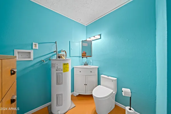 a bathroom with a toilet and a sink