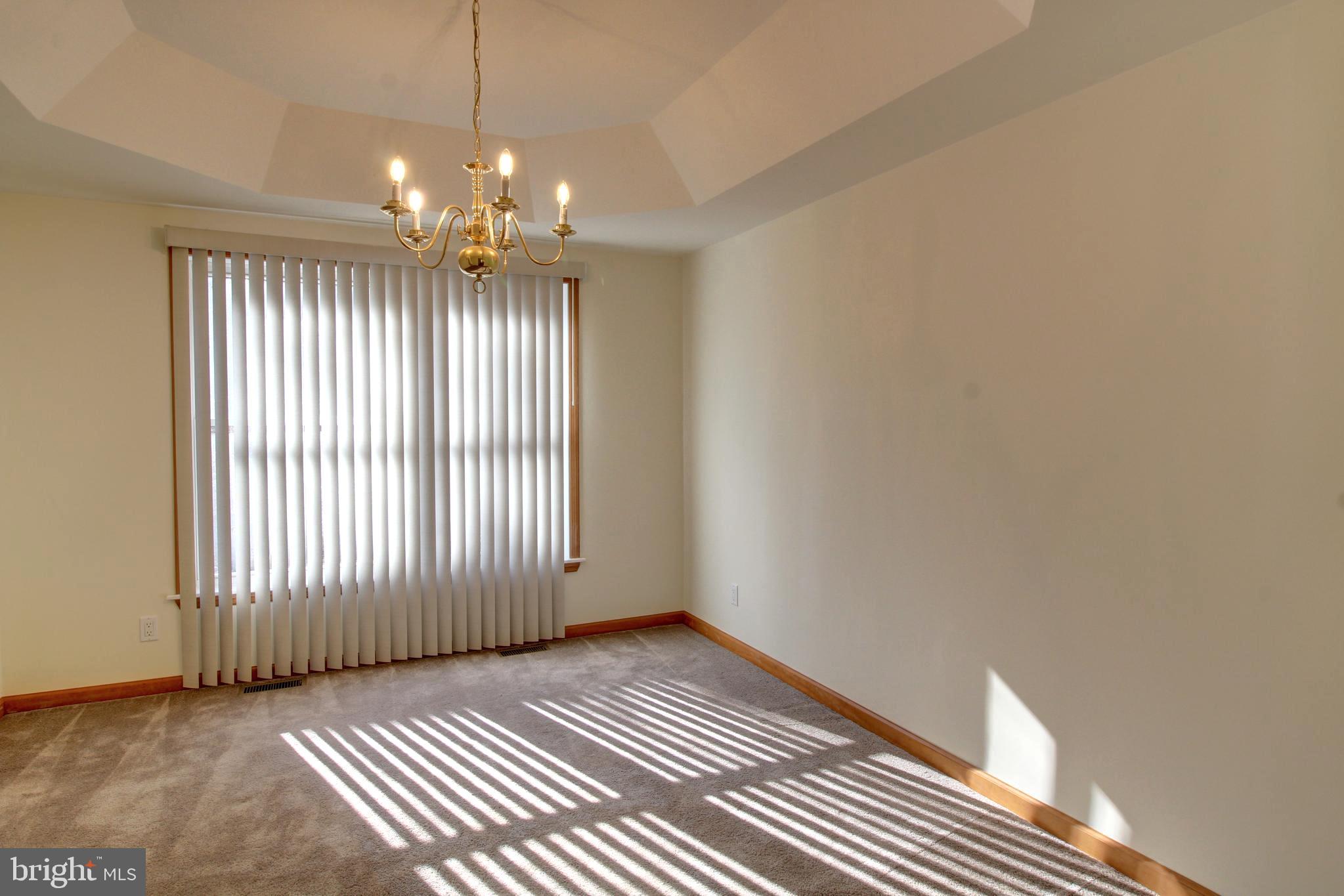 745 Fire Trail Road Front Royal, VA 22630 - Photo 19 of 58 a view of an empty room with window and chandelier fan