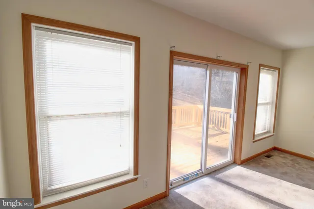 a view of entryway with wooden floor