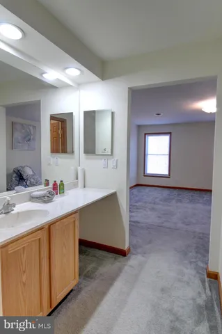 a view of room with window and lounge chair