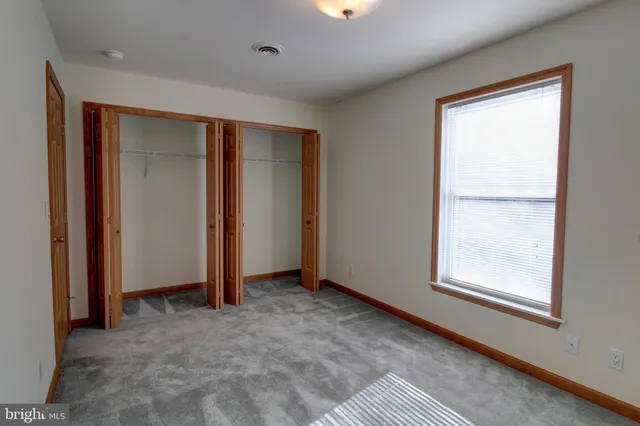 a bathroom with a sink double vanity and a mirror