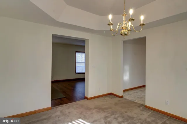 a view of a chandelier in a room with a chandelier