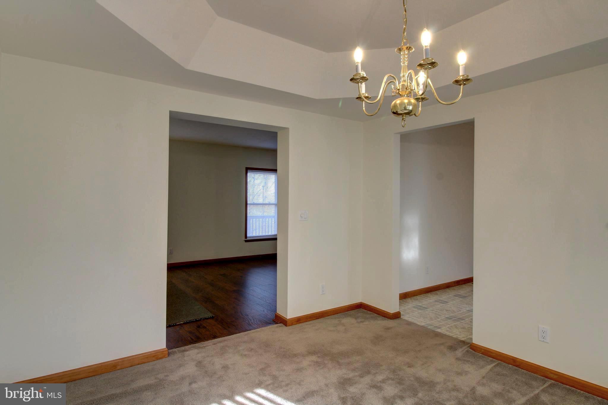 745 Fire Trail Road Front Royal, VA 22630 - Photo 4 of 58 a view of a chandelier in a room with a chandelier