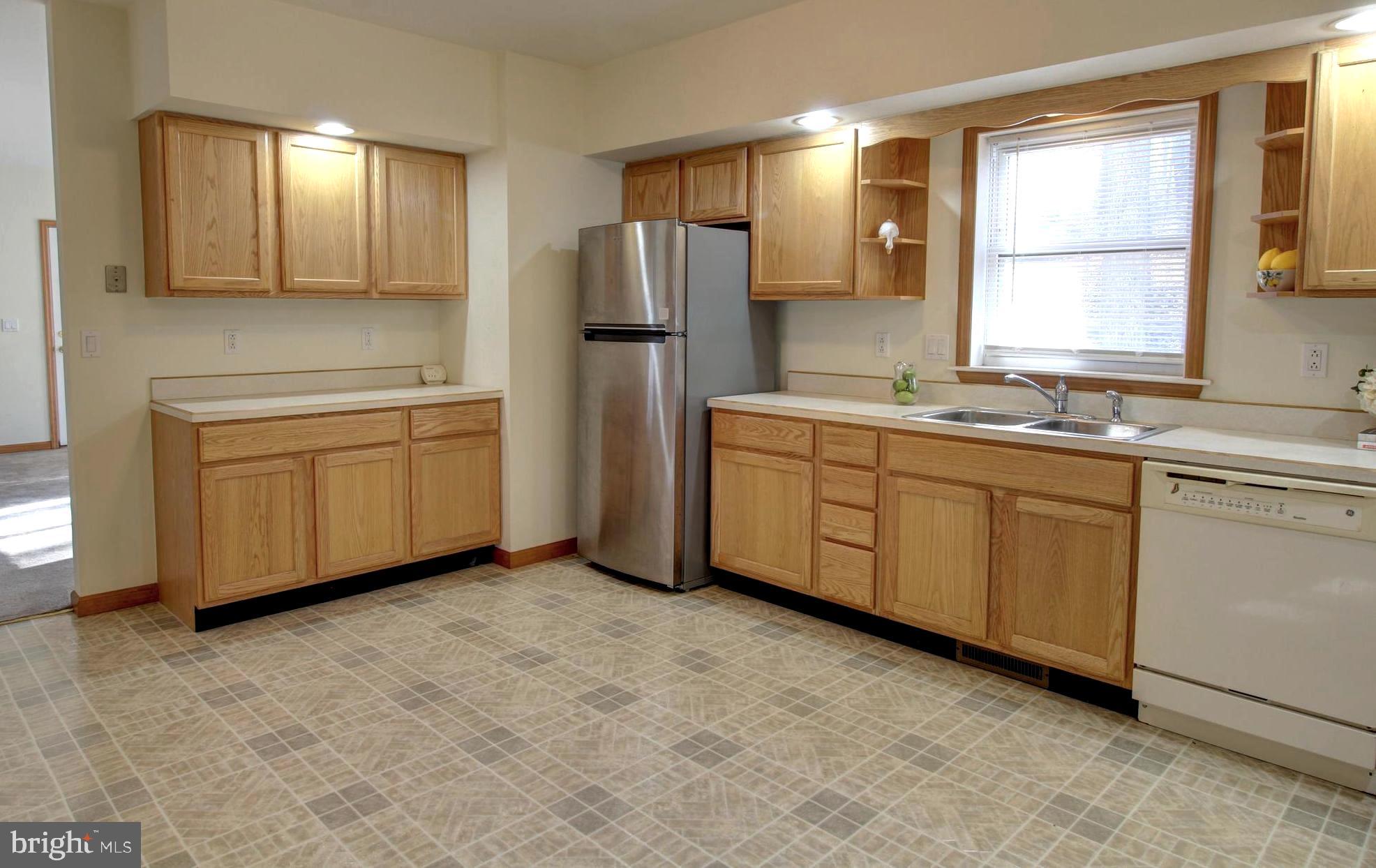745 Fire Trail Road Front Royal, VA 22630 - Photo 7 of 58 a kitchen with stainless steel appliances a sink stove and refrigerator