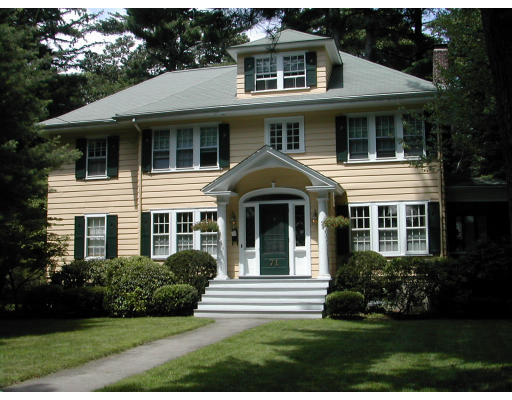 71 Avalon Road Newton, MA 02468 - Photo 1 of 1 a view of a white house with large windows and a yard with plants and trees