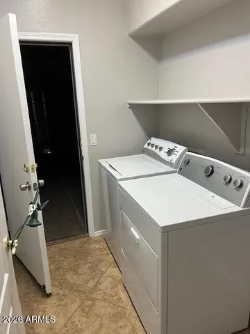 a utility room with washer and dryer