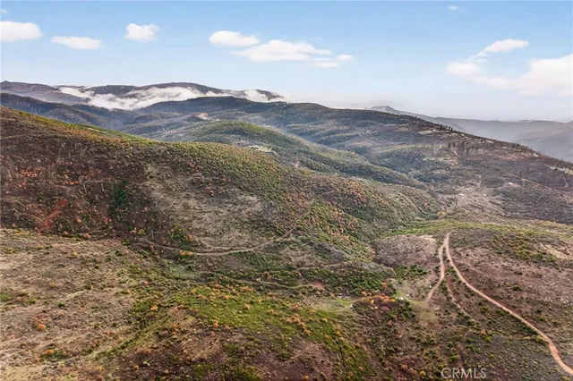 a view of mountains and valleys