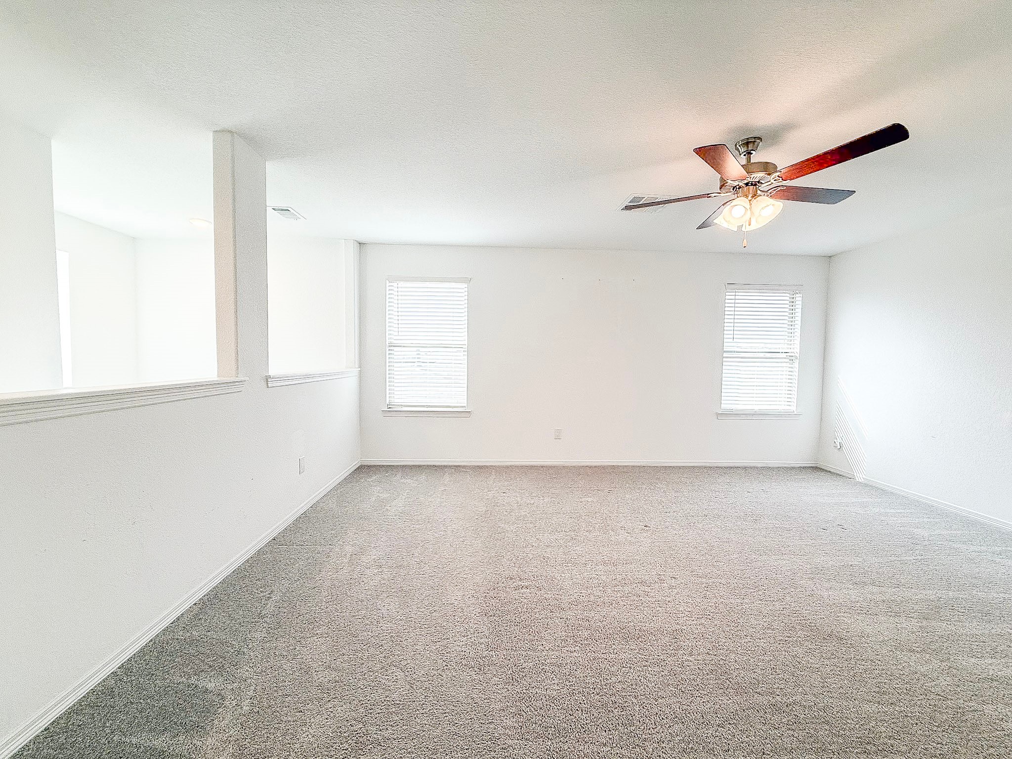 19623 Cat Spruce Court Porter, TX 77365 - Photo 17 of 25 an empty room with windows and fan