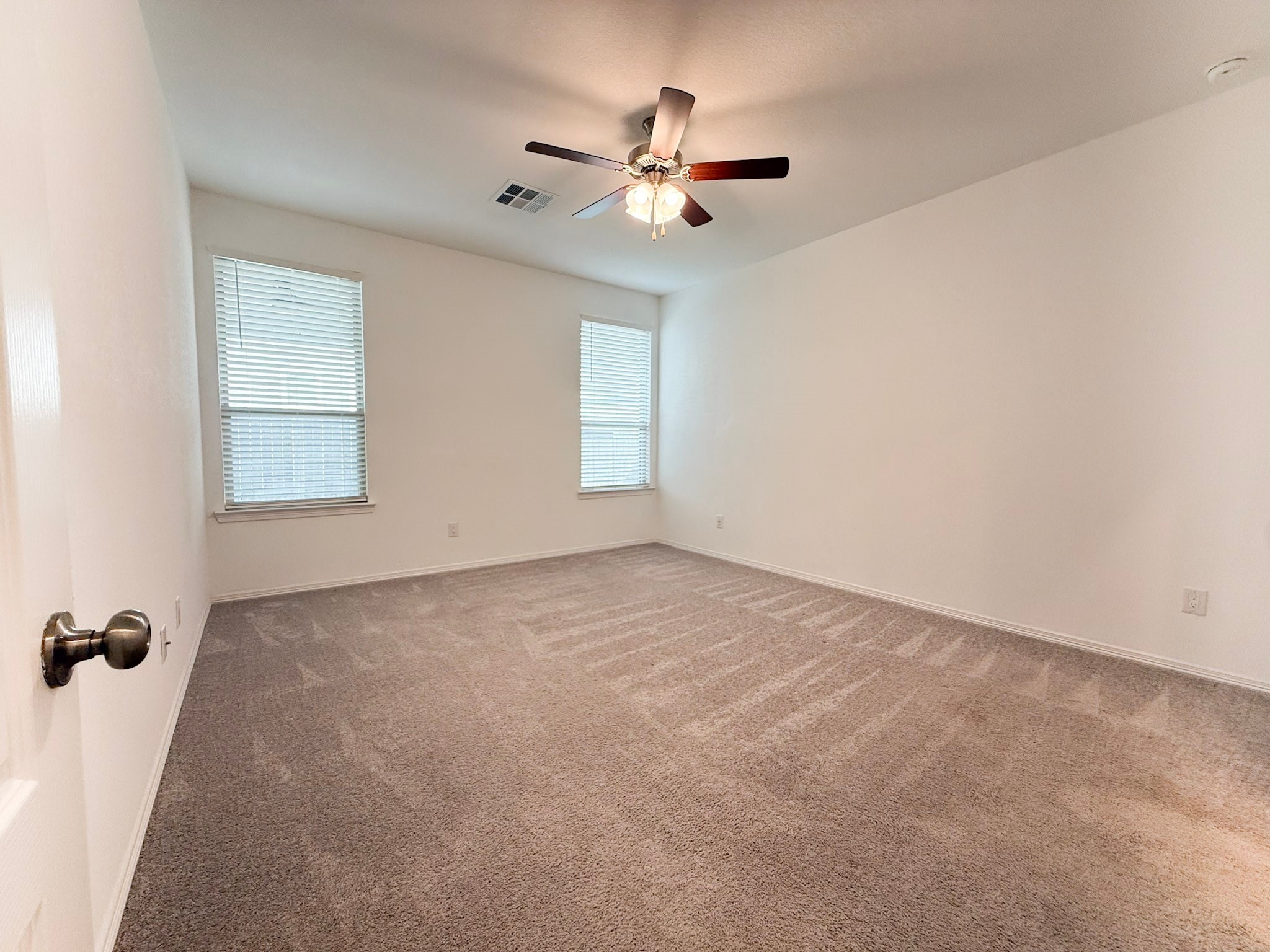 19623 Cat Spruce Court Porter, TX 77365 - Photo 20 of 25 an empty room with windows and fan