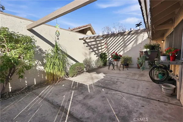 a dining room filled with furniture and flowers
