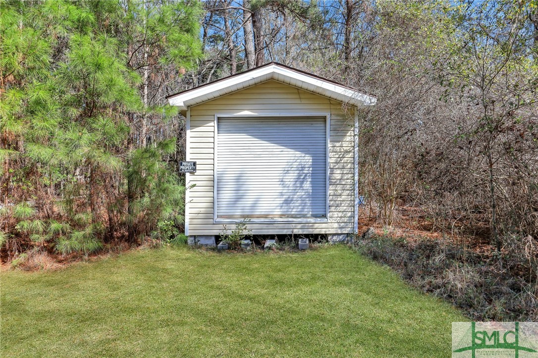348 Blandford Road Rincon, GA 31326 - Photo 23 of 25 Garage - accessed by the mowed path