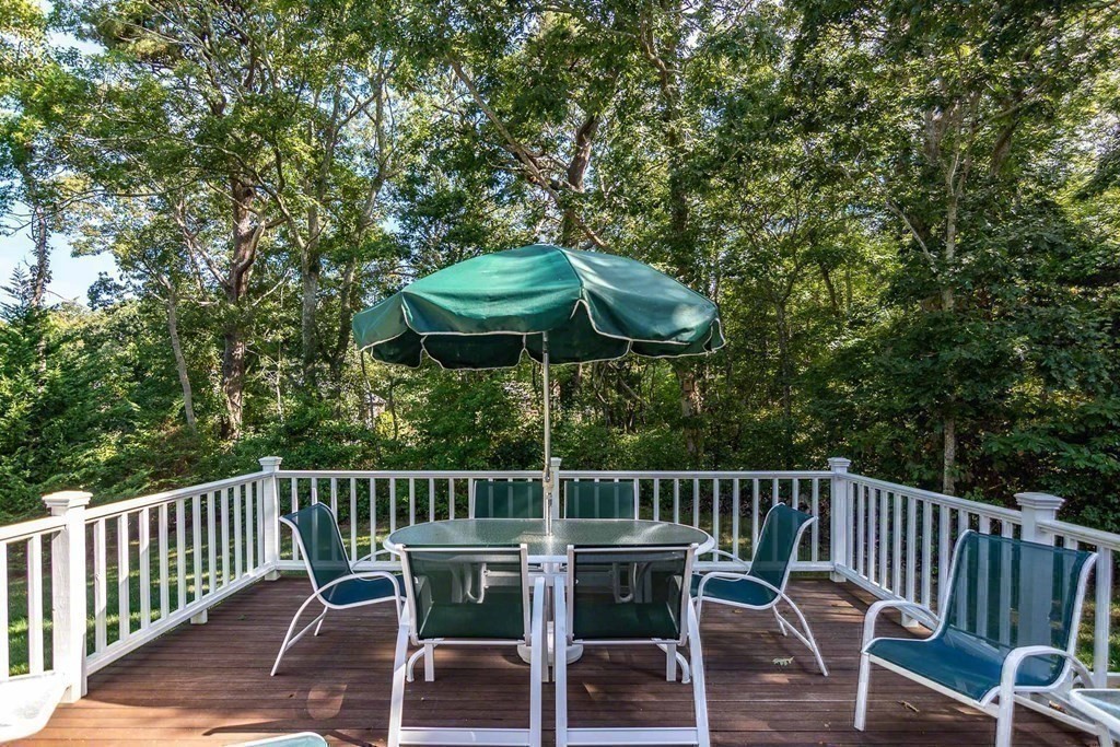 196 Springhill Road Tisbury, MA 02568 - Photo 13 of 32 a view of a chair and table on the deck