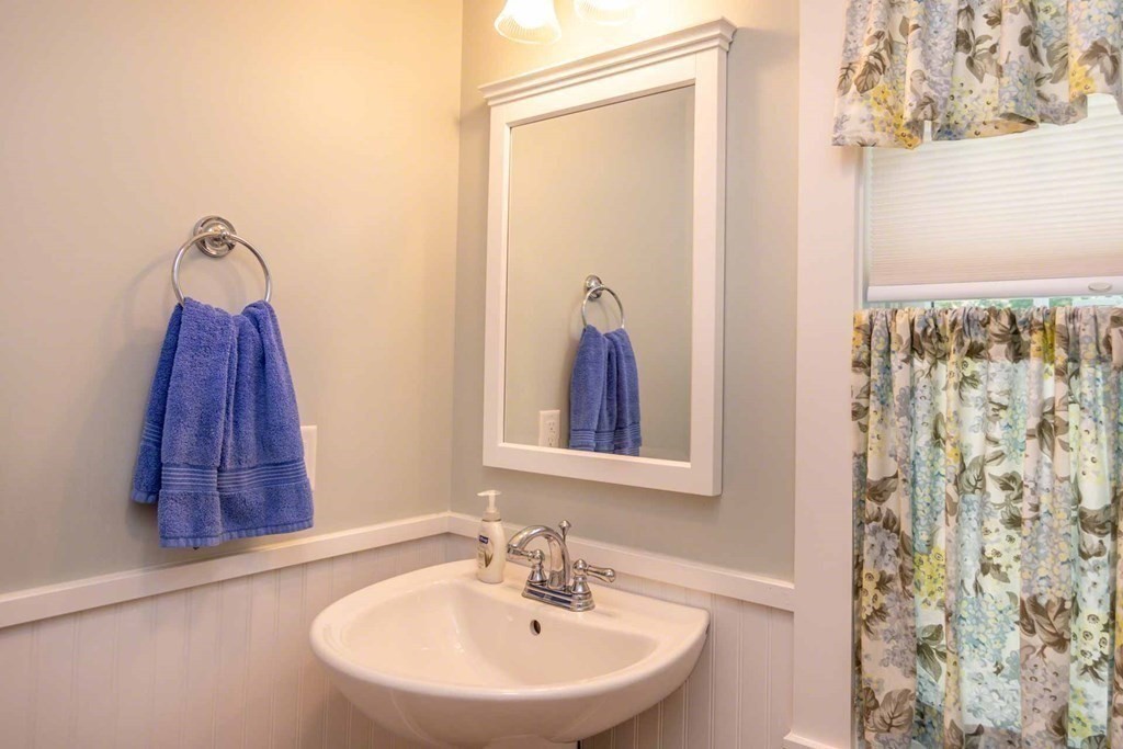 196 Springhill Road Tisbury, MA 02568 - Photo 14 of 32 a bathroom with a sink and a mirror