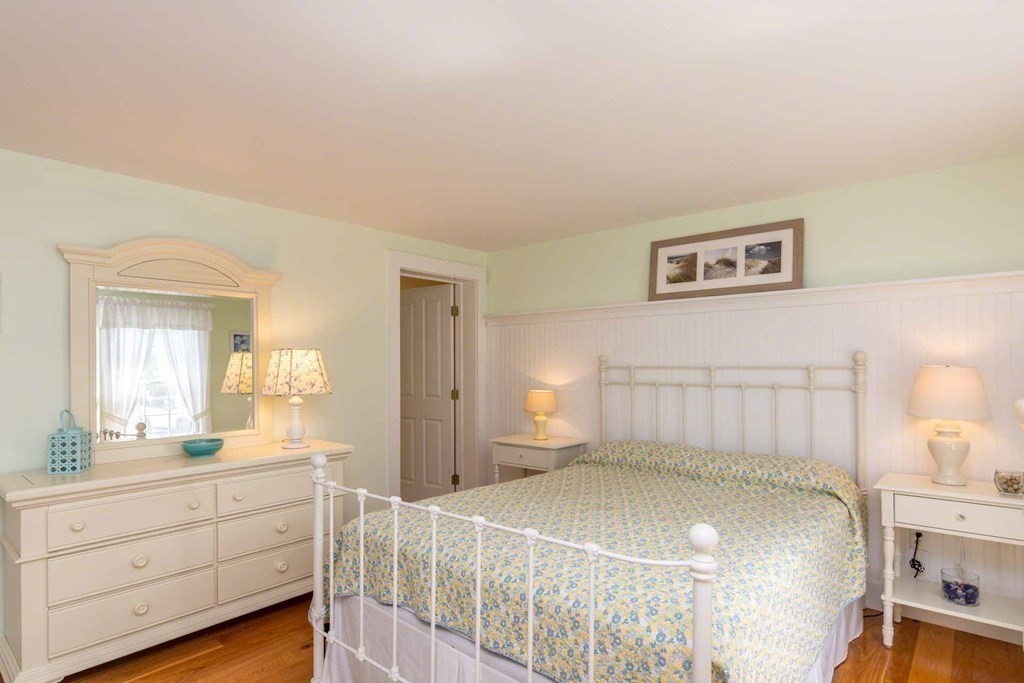 196 Springhill Road Tisbury, MA 02568 - Photo 16 of 32 a bedroom with a bed and a dresser