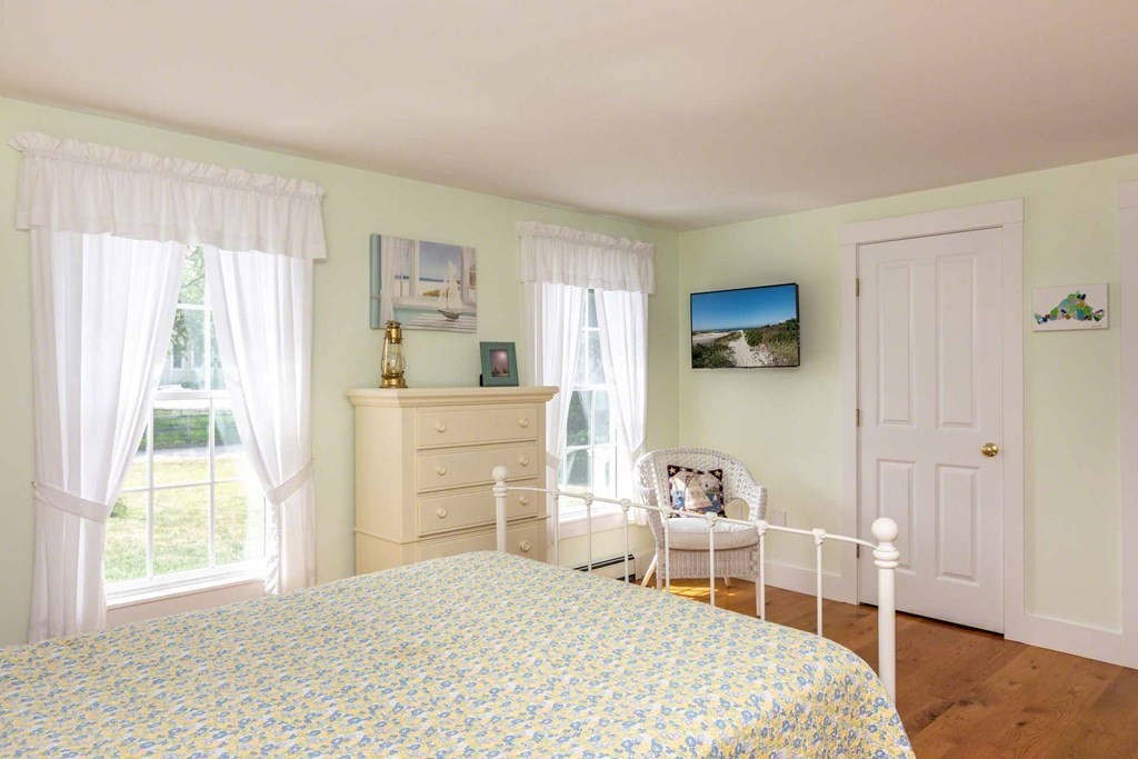 196 Springhill Road Tisbury, MA 02568 - Photo 17 of 32 a bedroom with a bed and a window