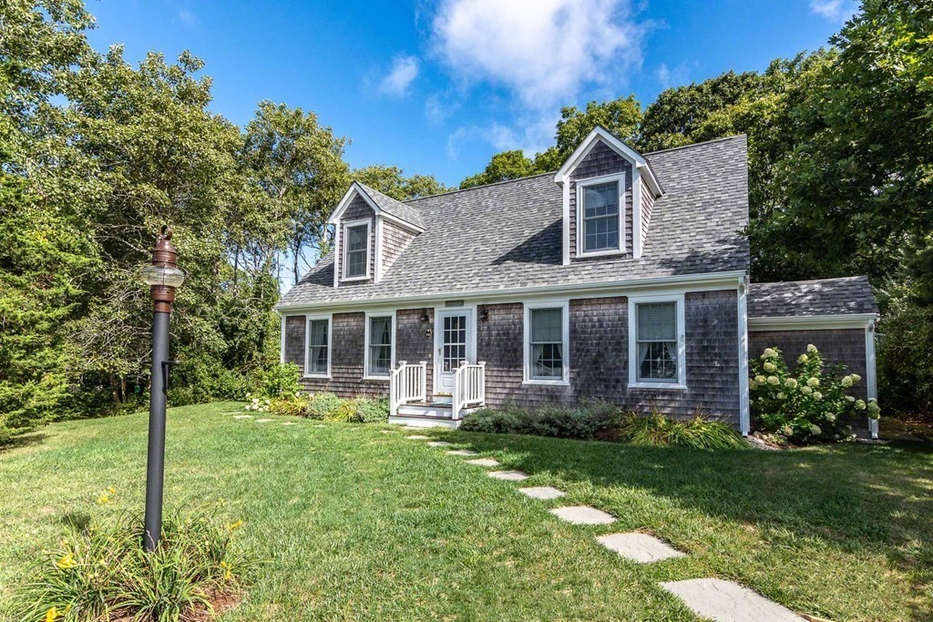 196 Springhill Road Tisbury, MA 02568 - Photo 2 of 32 a front view of a house with garden