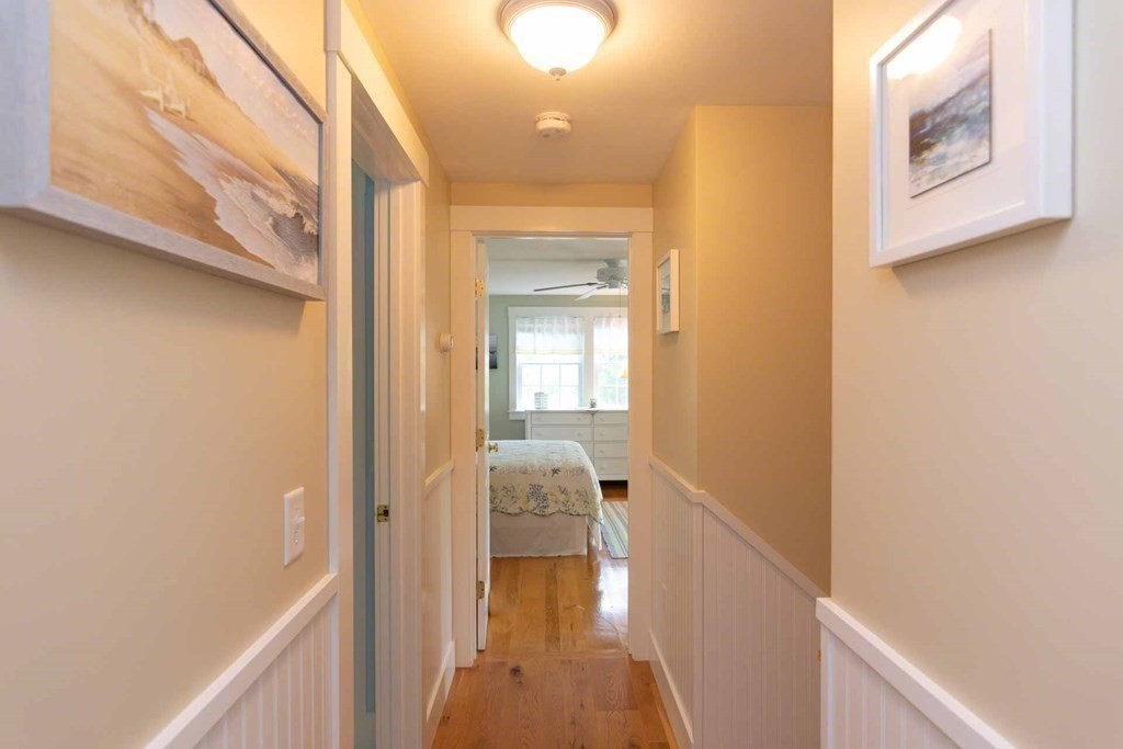 196 Springhill Road Tisbury, MA 02568 - Photo 21 of 32 a view of a hallway with wooden floor and staircase