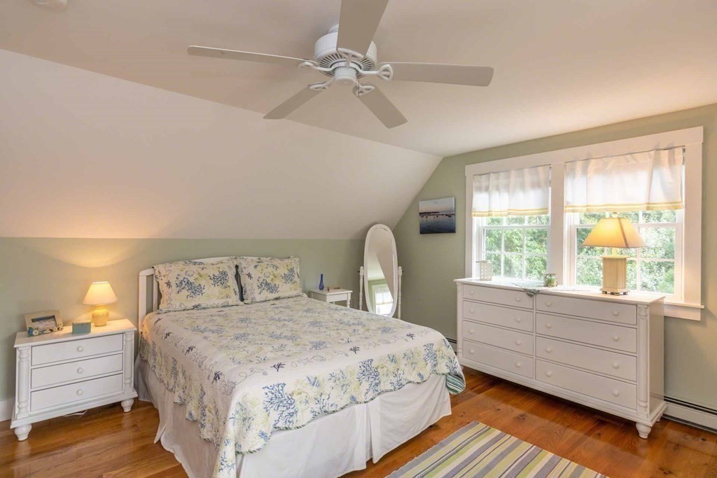 196 Springhill Road Tisbury, MA 02568 - Photo 22 of 32 a spacious bedroom with a bed and a window