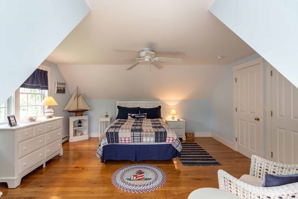 196 Springhill Road Tisbury, MA 02568 - Photo 25 of 32 a living room with furniture and a chandelier