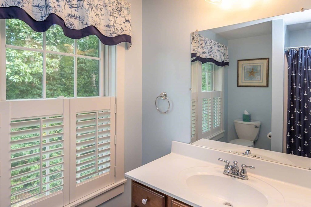 196 Springhill Road Tisbury, MA 02568 - Photo 28 of 32 a bathroom with a sink and a mirror