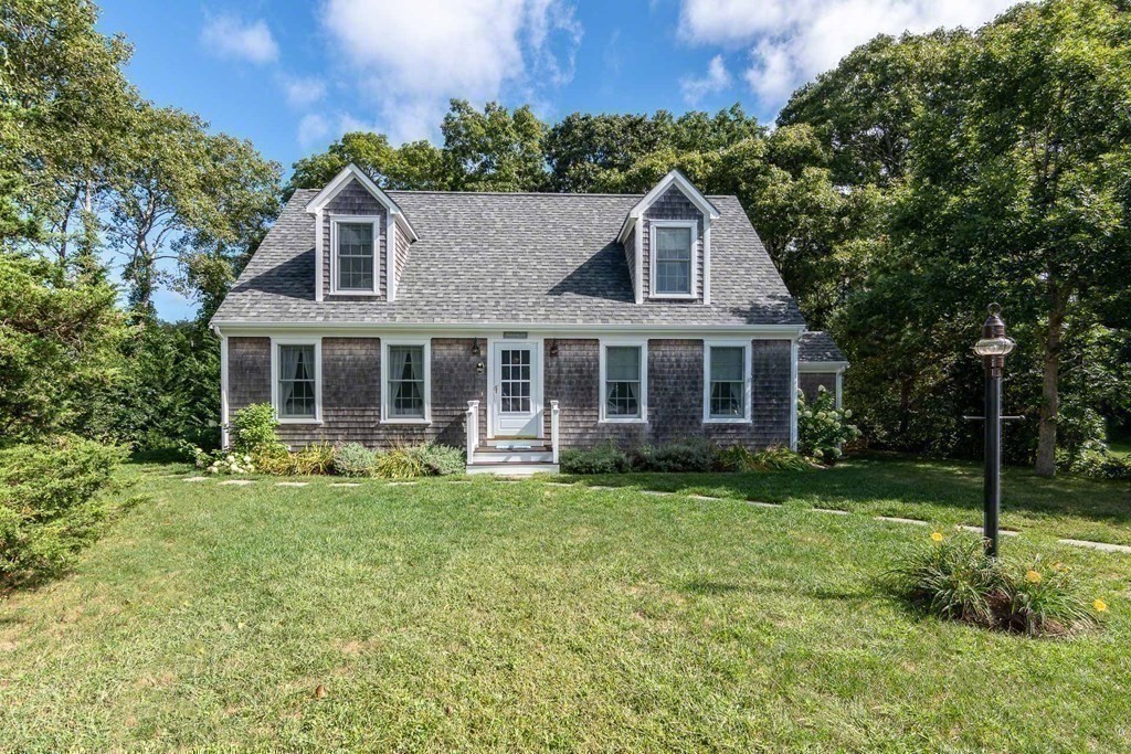 196 Springhill Road Tisbury, MA 02568 - Photo 32 of 32 a front view of a house with a yard