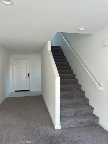 a bathroom with a toilet sink and shower