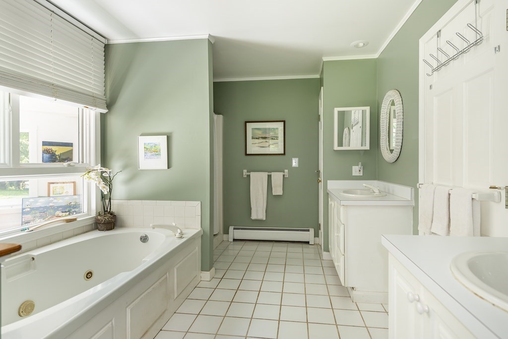 21 Mill Road Ipswich, MA 01938 - Photo 14 of 23 a bathroom with a sink a toilet and shower